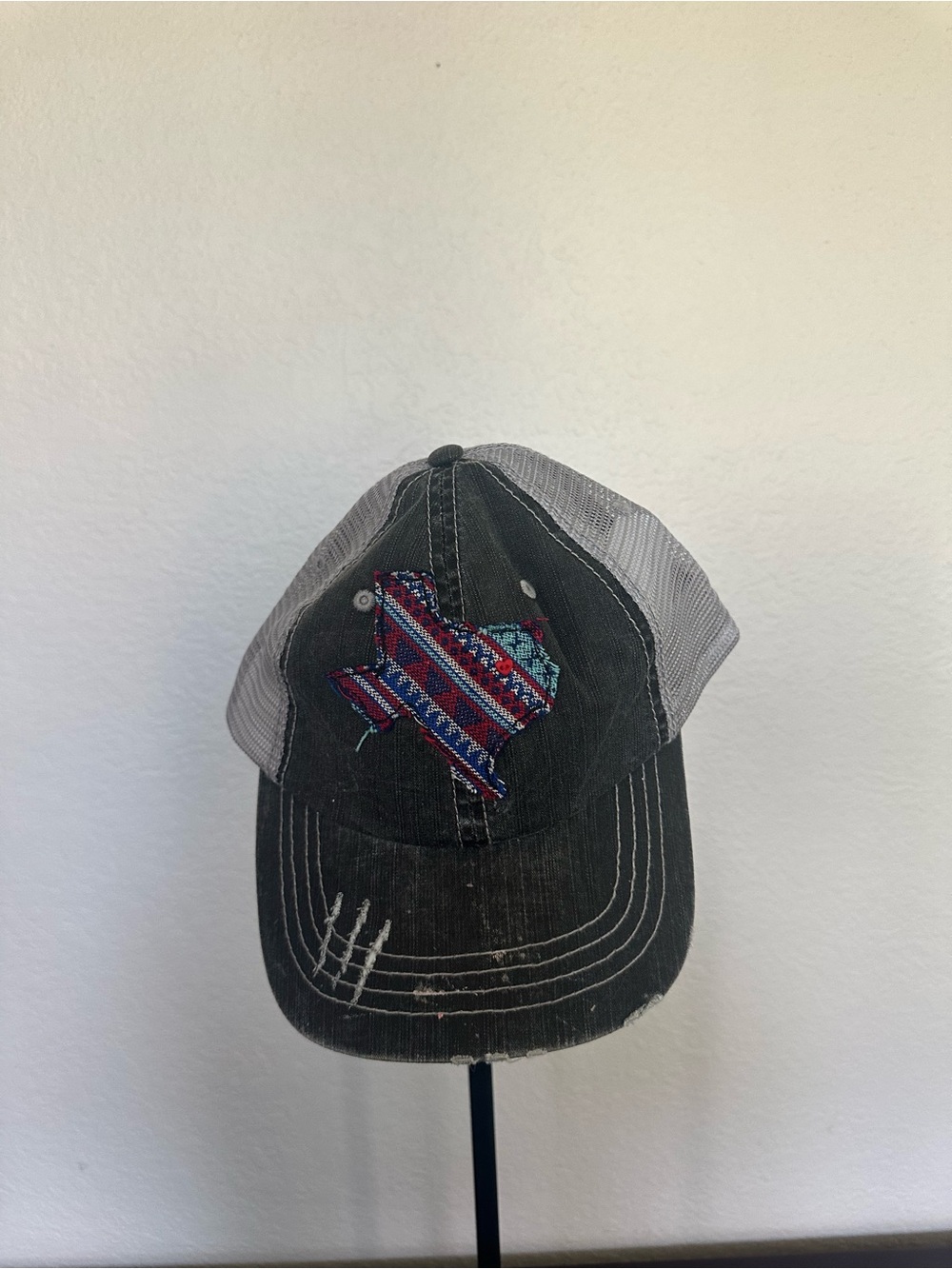 Taylor Gray and Black Mesh Trucker Hat with Blue Patch